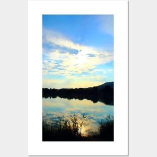 Mystical view with vegetation in the foreground, indistinct waters, Marche hills and azure sky Posters and Art